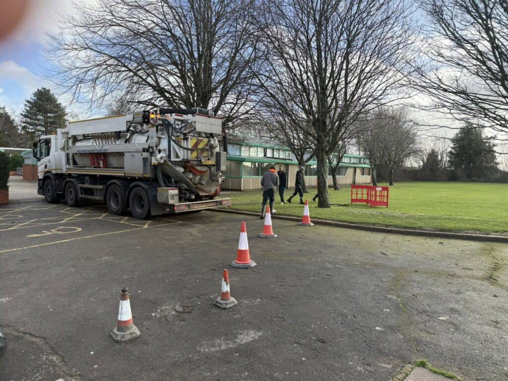 Drainage vehicle performing soakaway and silt removal at Holbury School, Holbury.
