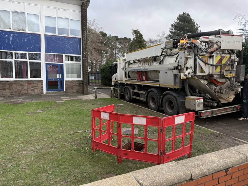 Drainage repair vehicle at Holbury School for soakaway and silt removal.